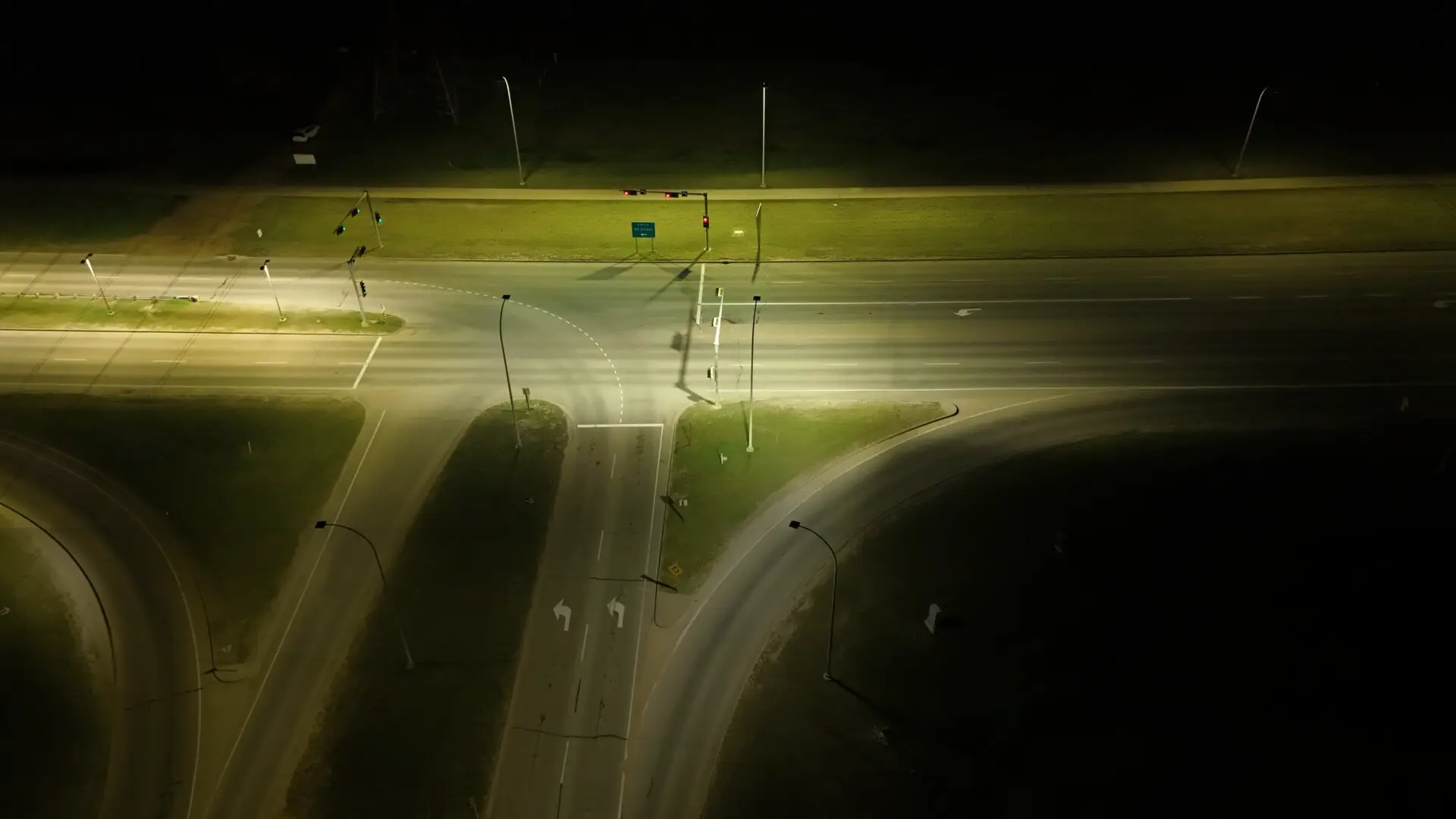Aerial nighttime view of illuminated highway interchange